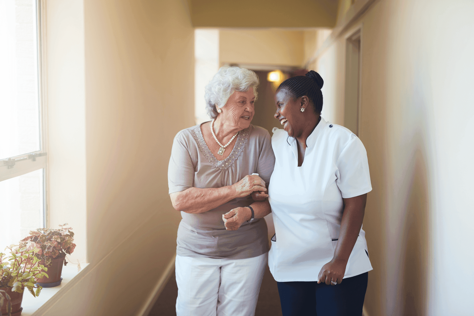 Compassionate caregiver assisting elderly person